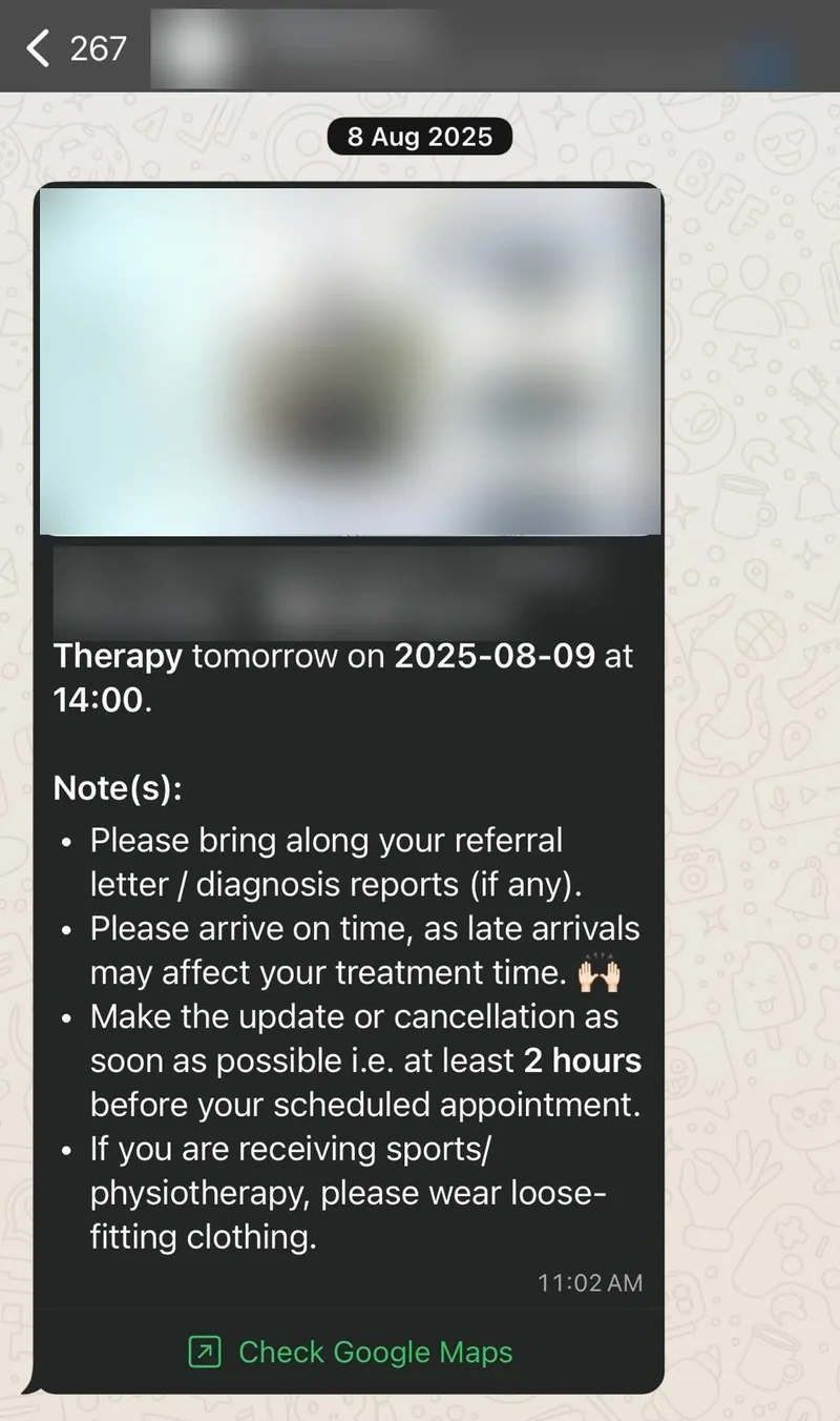 A WhatsApp reminder sent the day before an appointment, with the venue card, time, and what to bring.